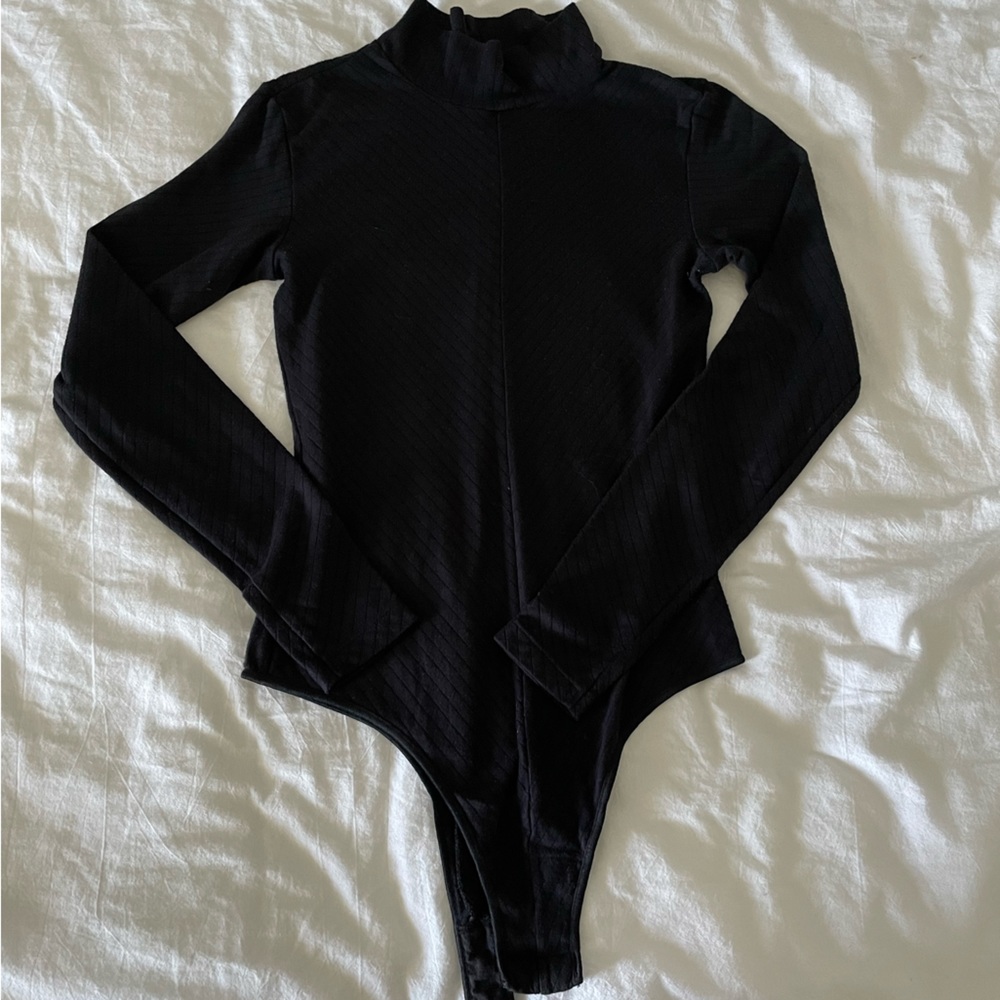 UNIQLO HEAT TECH turtleneck bodysuit.
